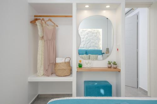 a bedroom with a mirror and a bed at 3 Wishes in Naxos Chora