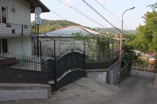 an iron gate in front of a house at Makos Guest House in Kutaisi