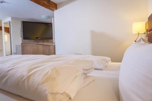Кровать или кровати в номере AKZENT Hotel Sternen