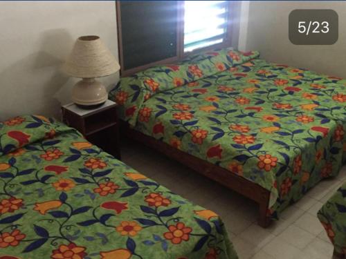 Katil atau katil-katil dalam bilik di Hotel El Kiosco