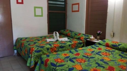 Katil atau katil-katil dalam bilik di Hotel El Kiosco