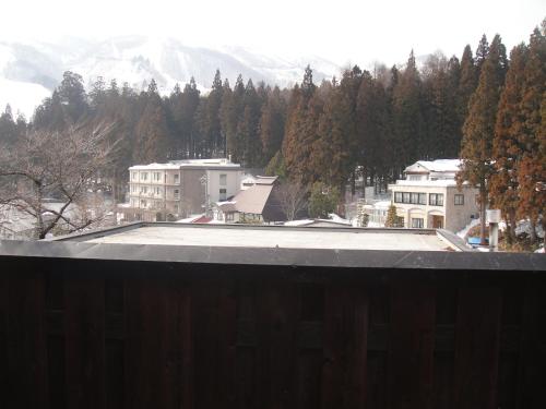 arial view of a building with a roof at Hakuba Hotel Hana-no-Sato in Hakuba