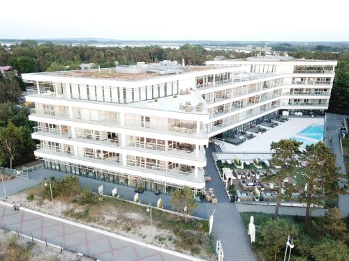 an aerial view of a large white building at Apartament Dune A 004 in Mielno