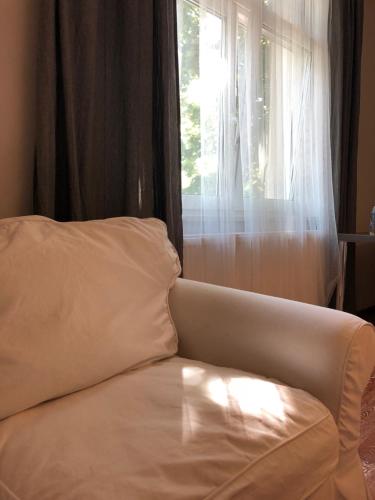 Ένα ή περισσότερα κρεβάτια σε δωμάτιο στο Noclegi Wrzeszcz