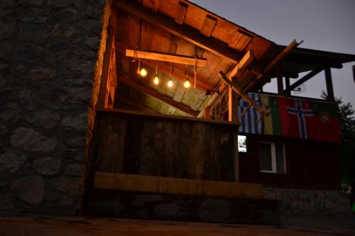 a building with lights on the side of it at Daeli Hotel in Mestia