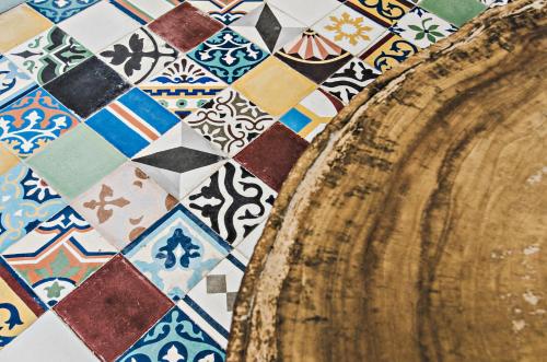 a room with a table and a tile floor at Moonshine Boutique Hostal in Cali