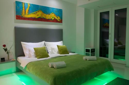a bedroom with a bed with two pillows on it at Organic Gardens Villa in Crikvenica