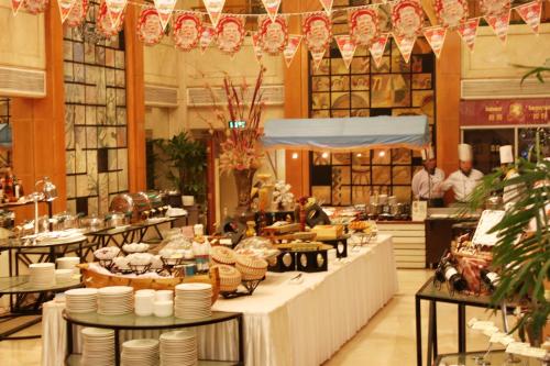 Restoran ili drugo mesto za obedovanje u objektu Qingdao Oceanwide Elite Hotel