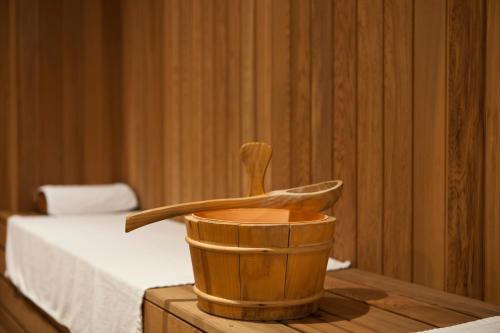 a wooden mortar and pestle on a table in a room at Lakeview Xuanwu Hotel in Nanjing