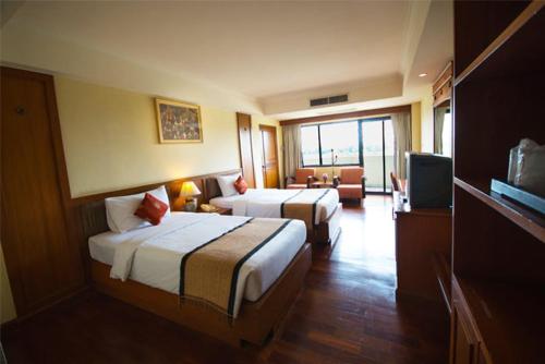 Chakungrao Riverview Hotelにあるベッド