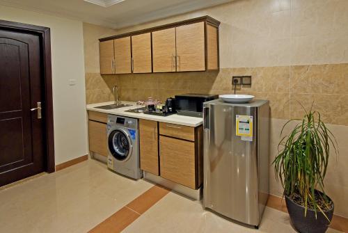 Η κουζίνα ή μικρή κουζίνα στο Delights Inn - Green Oasis Hotel