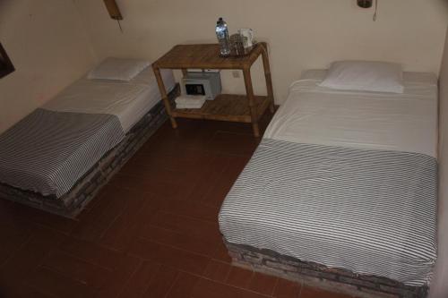
Tempat tidur dalam kamar di Cimajasquare Hotel & Restaurant
