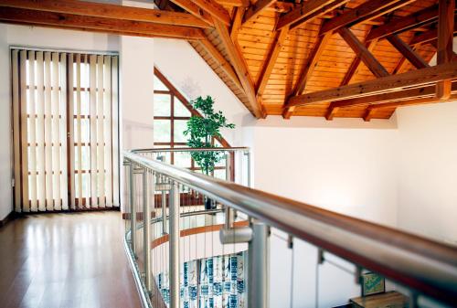 a staircase in a building with a plant at The Pearl of Balaton in Szigliget