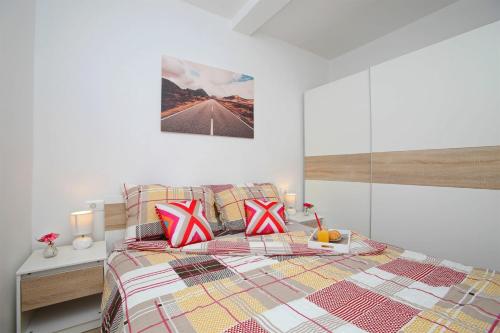 Ένα ή περισσότερα κρεβάτια σε δωμάτιο στο Apartman Paolo