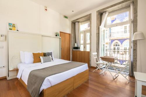 Giường trong phòng chung tại Stay in Apartments - S. Bento