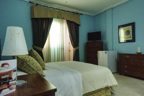 Кровать или кровати в номере Hotel La Colina