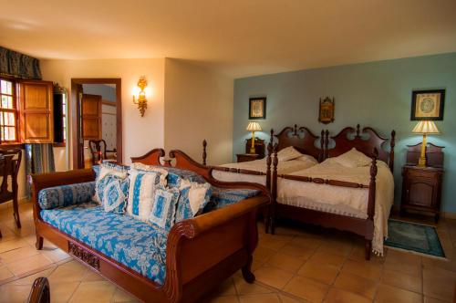 מיטה או מיטות בחדר ב-Finca Arminda