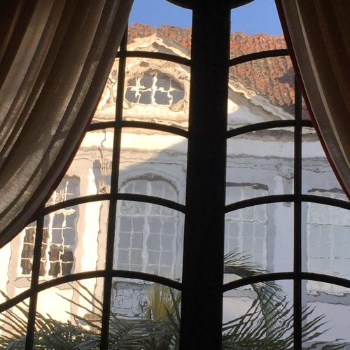 a view of a building through a window at B&B The Verhaegen in Ghent