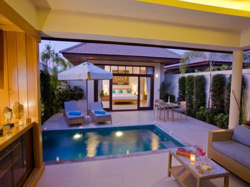 a swimming pool in a villa with a living room at Samui Boat Lagoon in Choeng Mon Beach