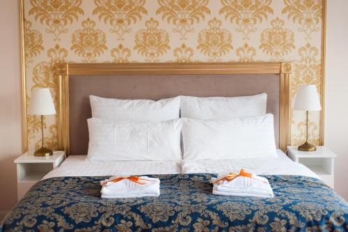 Łóżko lub łóżka w pokoju w obiekcie Folwark Ńemino