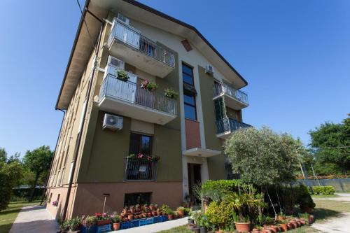 an apartment building with flowers on the balconies at Camping Klaus in Cavallino-Treporti