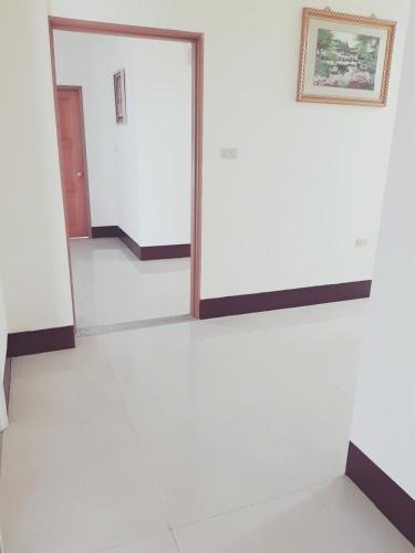 a mirror in a room with white walls at Jinlun Village Homestay in Taimali