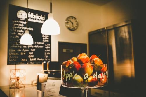 a bowl of fruit sitting on top of a table at Ostel Jugendhotel Bremervörde in Bremervörde