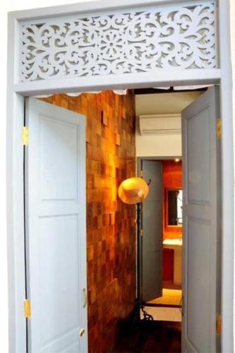 a door leading into a room with a hallway at Baan Noppawong in Bangkok