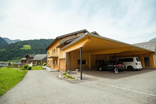 a house with a car parked in front of it at Haus Sonnseite in Au im Bregenzerwald