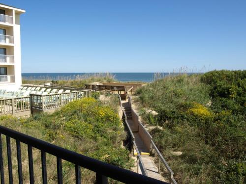 a stairway leading down to the beach from a building at Surf Side Hotel in Nags Head