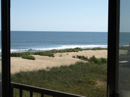 a view of the beach from a window at Surf Side Hotel in Nags Head