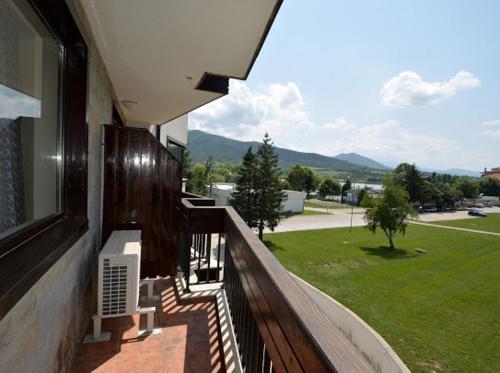 a balcony of a house with a view of a park at Pravets Resort Apartments in Pravets