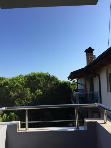 a balcony with a railing in front of a house at Hotel Otrant in Velipojë