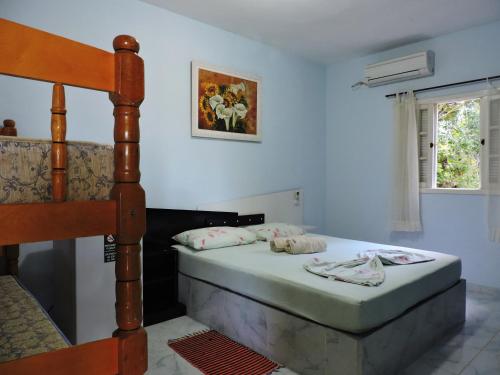 Katil atau katil-katil dalam bilik di Pousada do Horto