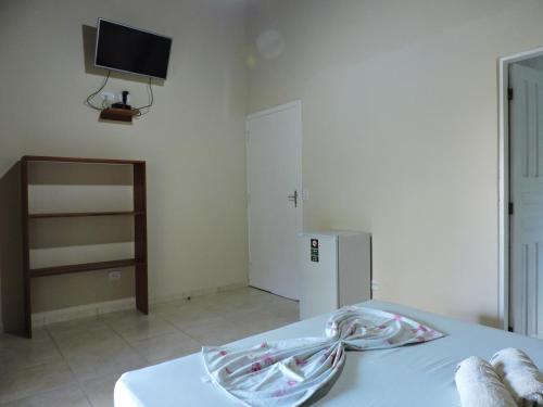 Ein Bett oder Betten in einem Zimmer der Unterkunft Pousada do Horto