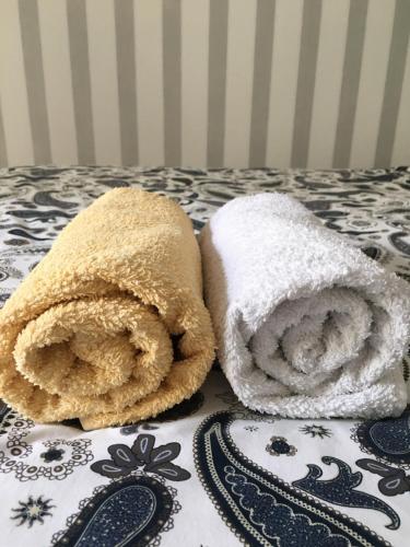 two towels sitting on top of a table at Apartament Praga in Warsaw