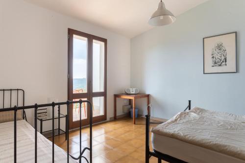 Ένα ή περισσότερα κρεβάτια σε δωμάτιο στο Casa Bea Bosa/Magomadas