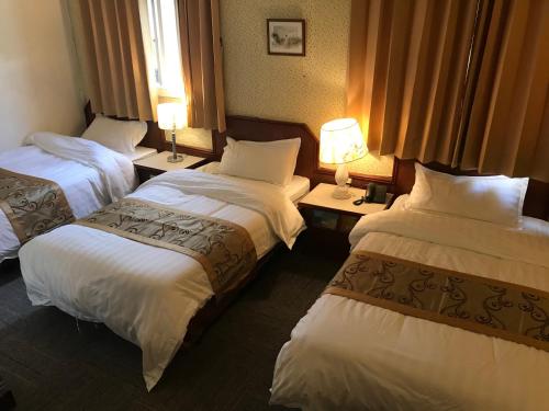 Una cama o camas en una habitación de Kinmen Laoye B&B