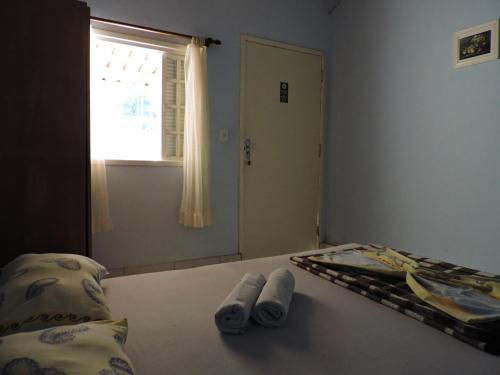 Ein Bett oder Betten in einem Zimmer der Unterkunft Pousada do Horto