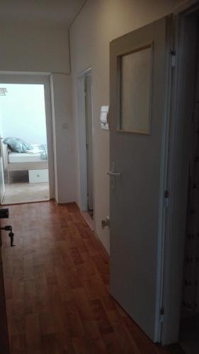 a room with a door and a bedroom with a bed at Lucka in Ústí nad Labem