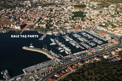 an aerial view of a marina with boats at Çeşme Kale Taş Apart in Cesme
