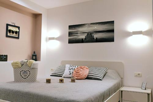 a bedroom with a bed with two pillows on it at Apartment Luce in Njivice