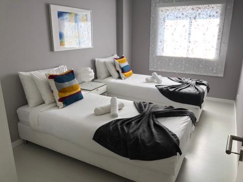 En eller flere senger på et rom på Gamboa Surf Apartment