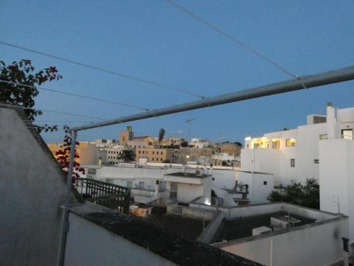 a view of a city from an apartment balcony at Maison d'O in Otranto