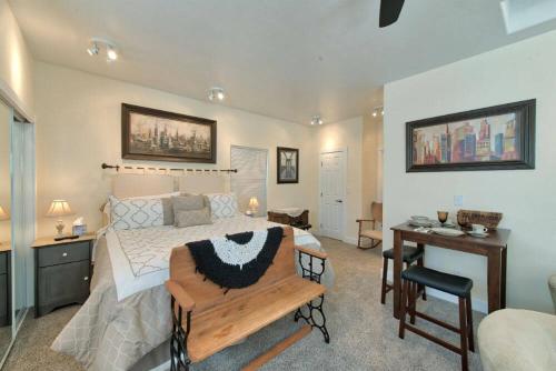 a bedroom with a bed and a desk and a desk at The St. Mary's Inn, Bed and Breakfast in Colorado Springs