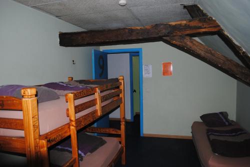 a bunk bed in a small room at Charlie Rockets Youth Hostel in Bruges