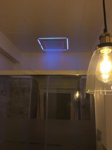 a light hanging from a ceiling in a room at Ragusa 2 al mare in Marina di Ragusa