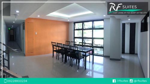a dining room with a table and chairs at RF Suites in Cebu City
