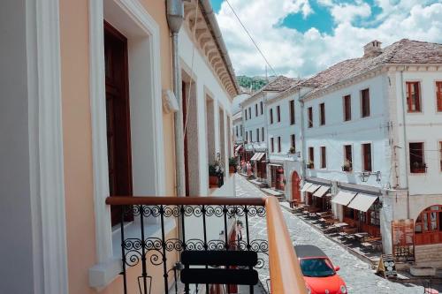 a view from a balcony of a street with buildings at Hotel Argjiro in Gjirokastër