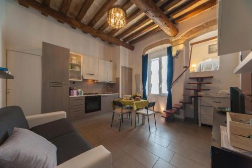 a living room with a couch and a table at Casa Vacanze Belleville in Trani